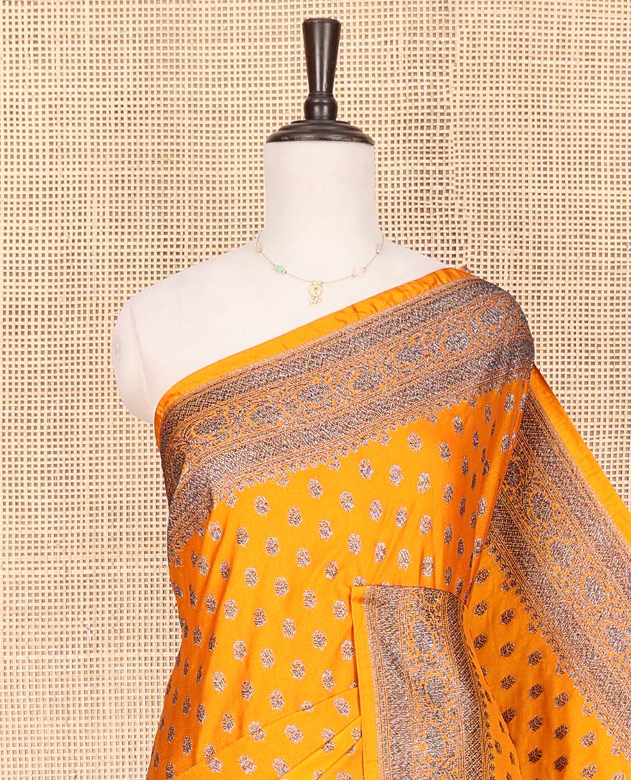 Orange Fancy Georgette Saree Bedecked with Zari Buttas, Hazily Zari Woven Border of Traditional Designs, Hazily Woven Pallu of Floral Jaal Designs, and Paired with a Matching Blouse