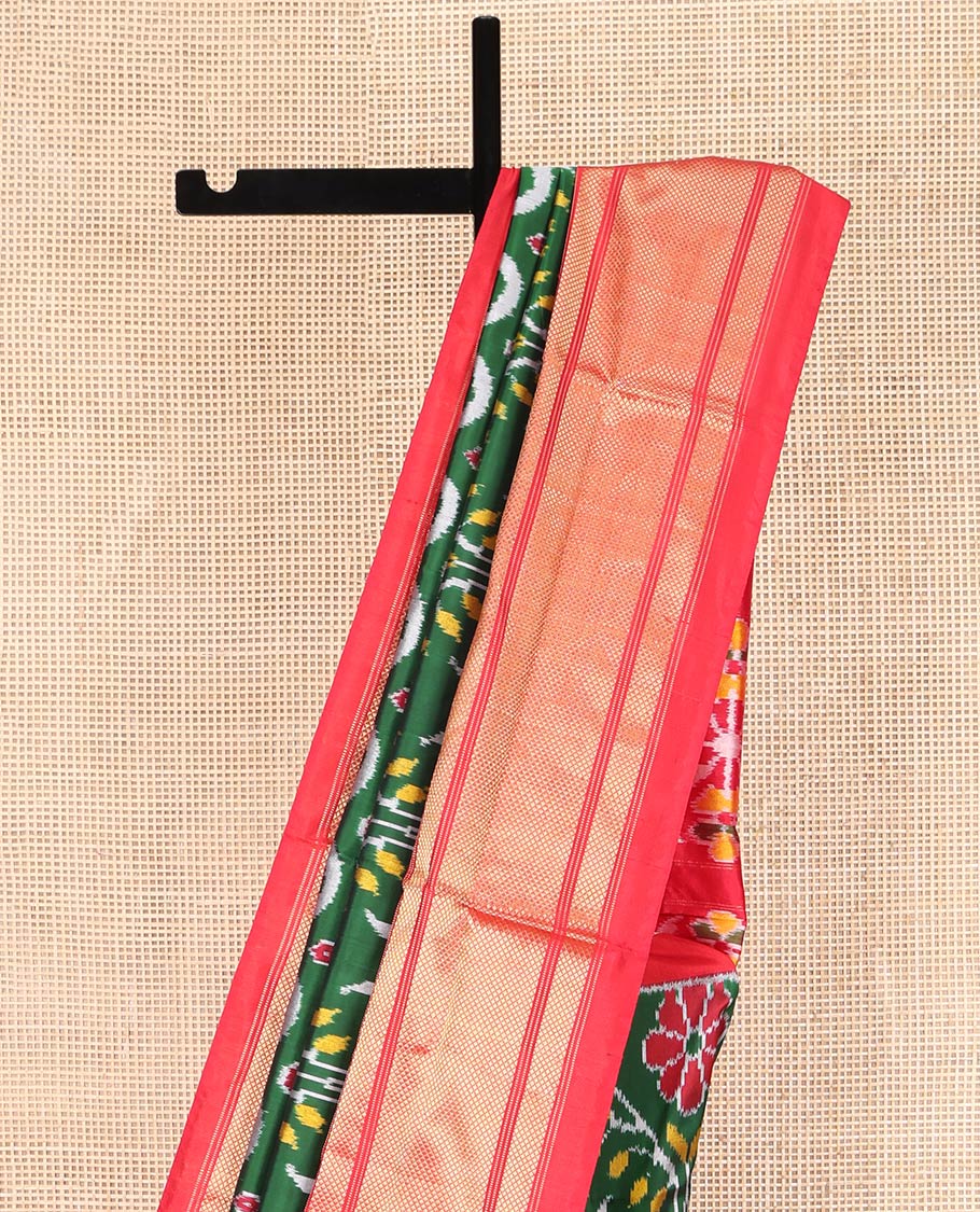 Green Ikkat Silk Saree, Enriched with Ikkat Floral Designs All Over Its Body, Complemented by a Contrast Temple Border of Diamond Zari Designs, Pallu of Floral Ikkat Designs, and Paired with a Contrast Blouse