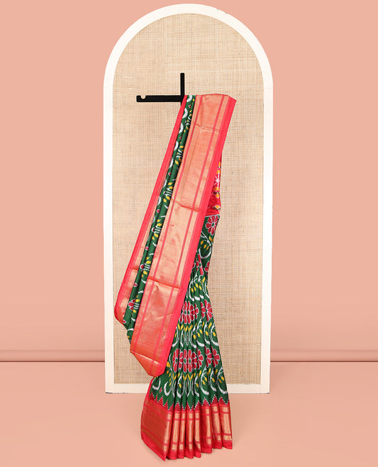 Green Ikkat Silk Saree, Enriched with Ikkat Floral Designs All Over Its Body, Complemented by a Contrast Temple Border of Diamond Zari Designs, Pallu of Floral Ikkat Designs, and Paired with a Contrast Blouse