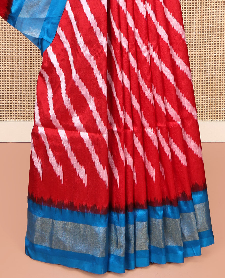 Red Pochampally Ikat Silk Saree, Delicately Woven with Stripes on Its Body, Complemented by a Contrast Border of Stripes, Pallu of Butta Enclosed Jaal Designs, and Paired with a Contrast Blouse