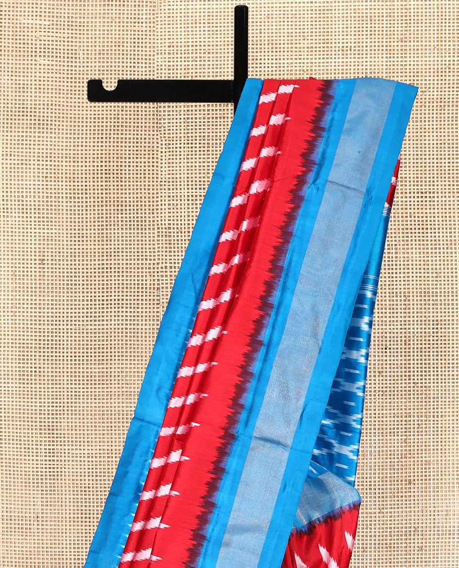 Red Pochampally Ikat Silk Saree, Delicately Woven with Stripes on Its Body, Complemented by a Contrast Border of Stripes, Pallu of Butta Enclosed Jaal Designs, and Paired with a Contrast Blouse
