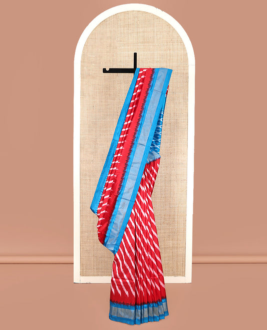 Red Pochampally Ikat Silk Saree, Delicately Woven with Stripes on Its Body, Complemented by a Contrast Border of Stripes, Pallu of Butta Enclosed Jaal Designs, and Paired with a Contrast Blouse