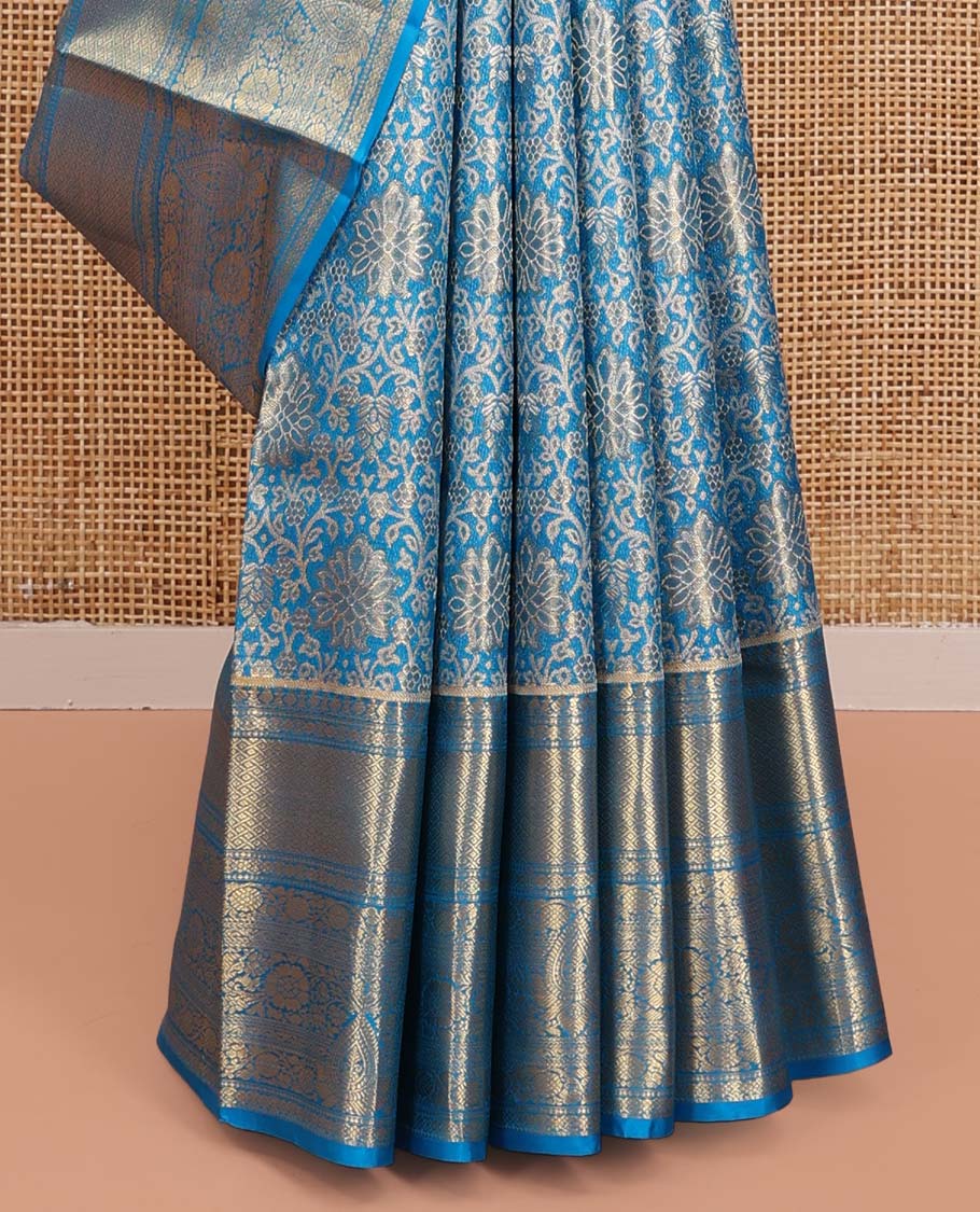 Blue Kanchipuram Tissue Silk Saree, Elegantly Framed with Jacquard Designs on Its Body, Highlighted by a Zari Border of Traditional Designs, Intricately Designed Pallu, and Paired with a Matching Blouse
