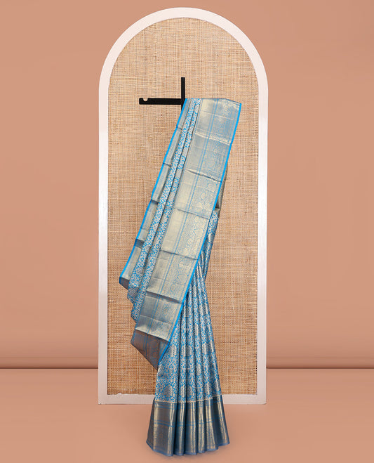 Blue Kanchipuram Tissue Silk Saree, Elegantly Framed with Jacquard Designs on Its Body, Highlighted by a Zari Border of Traditional Designs, Intricately Designed Pallu, and Paired with a Matching Blouse