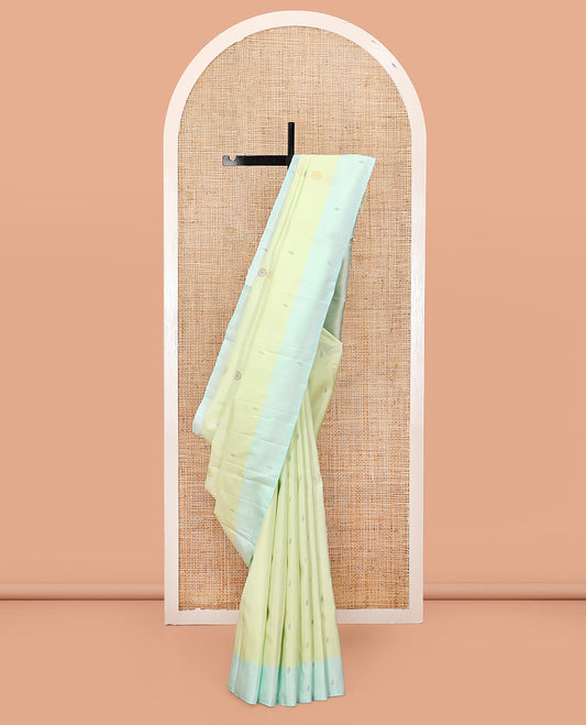 Green Kanchipuram Silk Saree, Subtly Sparkled with Stripes and Thread Buttas, Complemented by a Contrast Border, Jaal Pallu, and Contrast Blouse