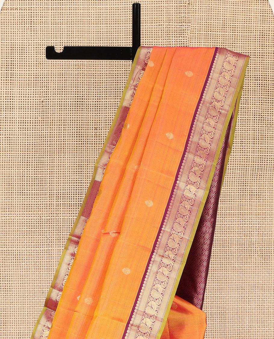 Orange Kanchipuram Silk Saree, Mesmerized with Zari Buttas on Its Body, Complemented by a Contrast Border of Muthu, Mayil Kann, and Mayil Designs, Grand Jaal Pallu, and Paired with a Contrast Blouse