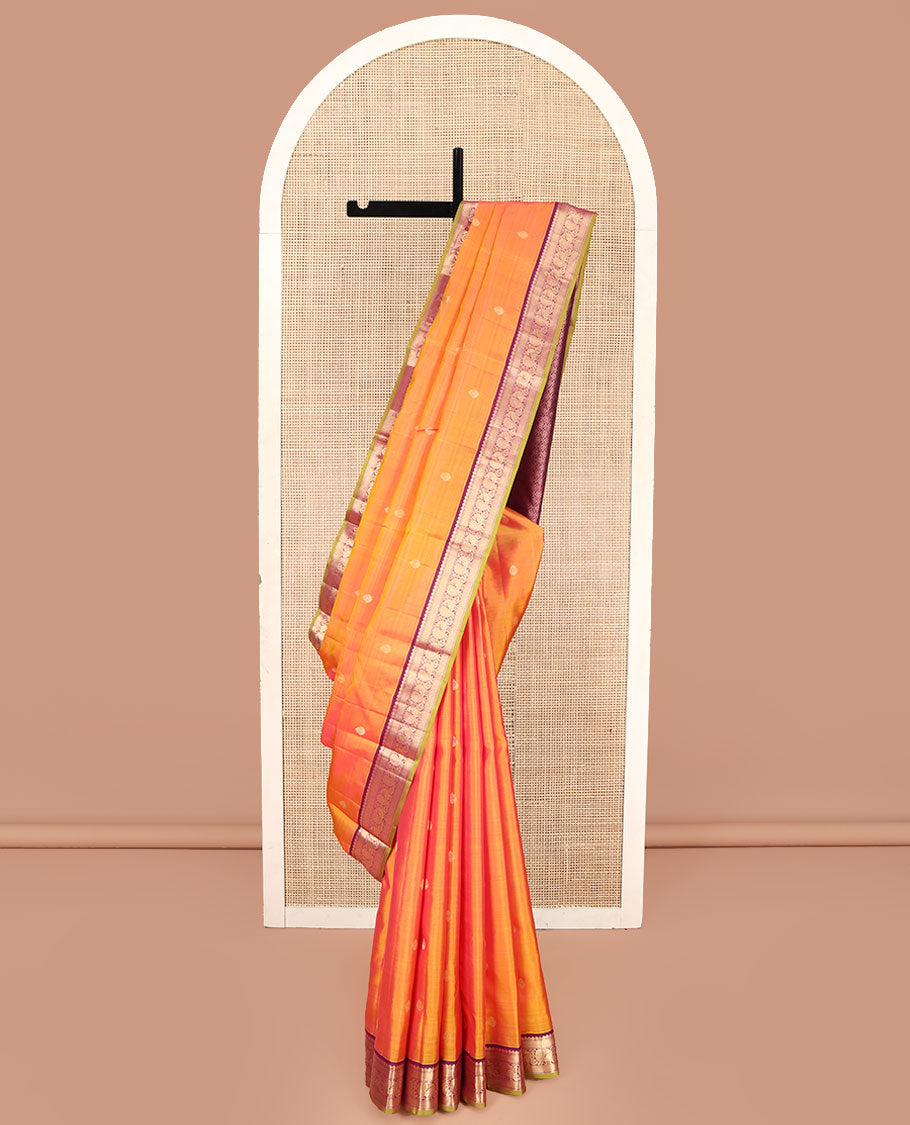 Orange Kanchipuram Silk Saree, Mesmerized with Zari Buttas on Its Body, Complemented by a Contrast Border of Muthu, Mayil Kann, and Mayil Designs, Grand Jaal Pallu, and Paired with a Contrast Blouse