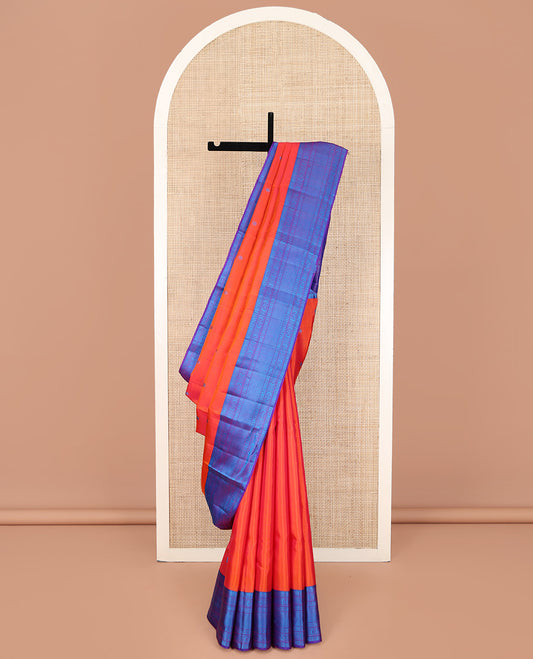Orange Kanchipuram Silk Saree, Bedecked with Mayil and Chakram Thread Buttas on Its Body, Complemented by a Contrast Border of Rekku, Kamalam, Poun, Chakram, Kuyil Kann, and Then Kuli Kann Designs, Jaal Design Pallu, and Paired with a Contrast Blouse