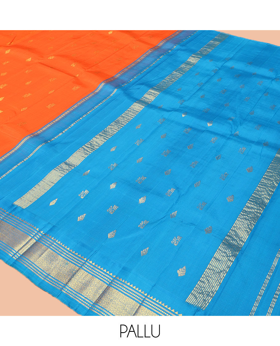 Orange Kanchipuram Silk Saree, Subtly Enriched with Zari Buttas on Its Body, Complemented by Contrast One-Sided Korvai Border of Rekku, Banaras, Muthu, and Mayil Kann Designs, Pallu Depicts Zari Designs, and Comes Without a Blouse
