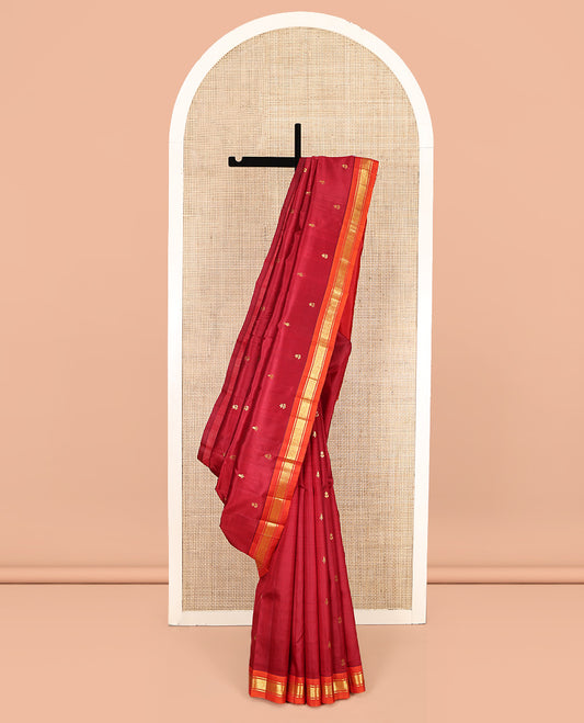 Red Kanchipuram Silk Saree Features Buttas, a Contrast One-Sided Border of Banaras, and Mayil Kann Designs, Zari Design Pallu, and No Blouse