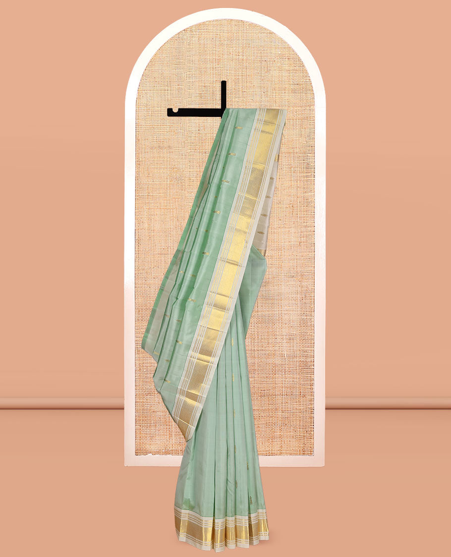 Pale Green Kanchipuram Silk Saree, Woven with Zari Buttas, Complemented by a Contrast One-Sided Border of Panner Sombu, Banaras, and Mayil Kann Designs, Zari Woven Pallu, and a No Blouse