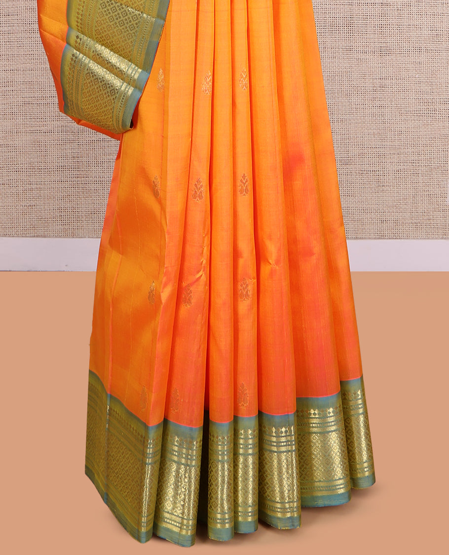 Orange Kanchipuram Silk Saree, Ornamented with Zari Buttas, a Contrast One-Sided Border of Paneer Sombu, Banaras, Muthu, and Jaal Design, Zari Design Pallu, and No Blouse