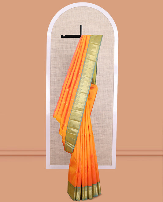Orange Kanchipuram Silk Saree, Ornamented with Zari Buttas, a Contrast One-Sided Border of Paneer Sombu, Banaras, Muthu, and Jaal Design, Zari Design Pallu, and No Blouse