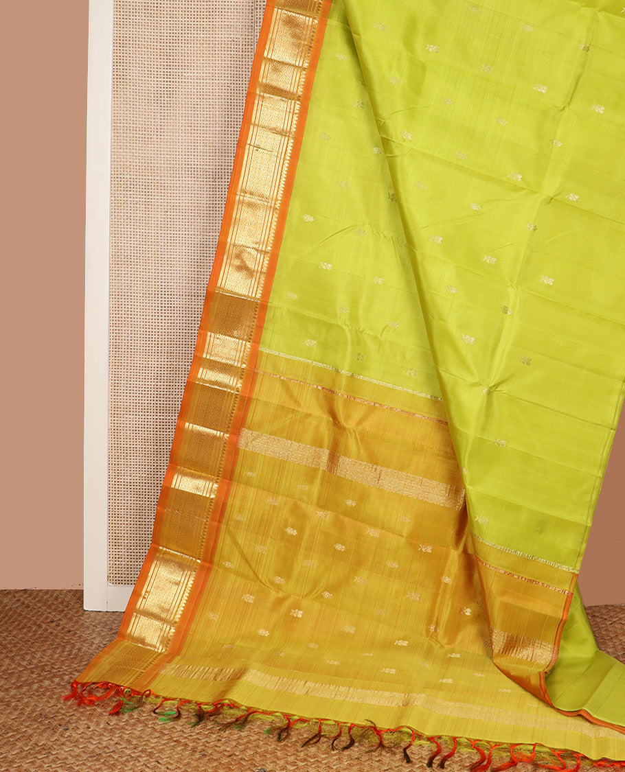 Green zari buttas Kanchipuram silk saree, contrast one-sided korvai border of thilakam mokku, banaras, and jaal design, and zari design pallu