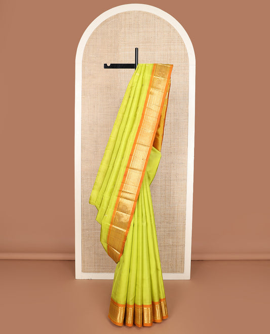 Green zari buttas Kanchipuram silk saree, contrast one-sided korvai border of thilakam mokku, banaras, and jaal design, and zari design pallu