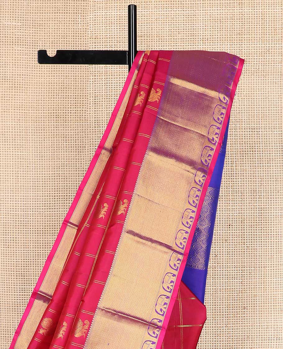 Red annam chakram buttas enclosed checked Kanchipuram silk saree, contrast border of rekku, muthu, mayil kann, and yaanai designs, and pallu of jaal, and peacock in the veena motifs