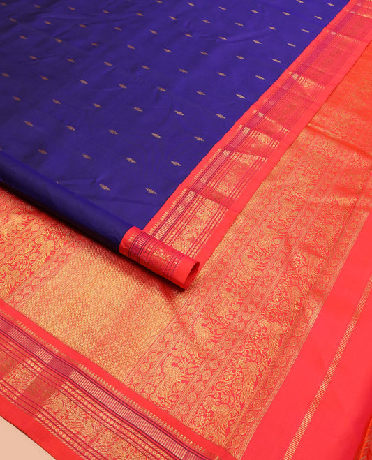 Blue zari buttas Kanchipuram silk saree, contrast border of thilakam mokku, muthu, banaras, and mayil designs, and pallu of intricate designs
