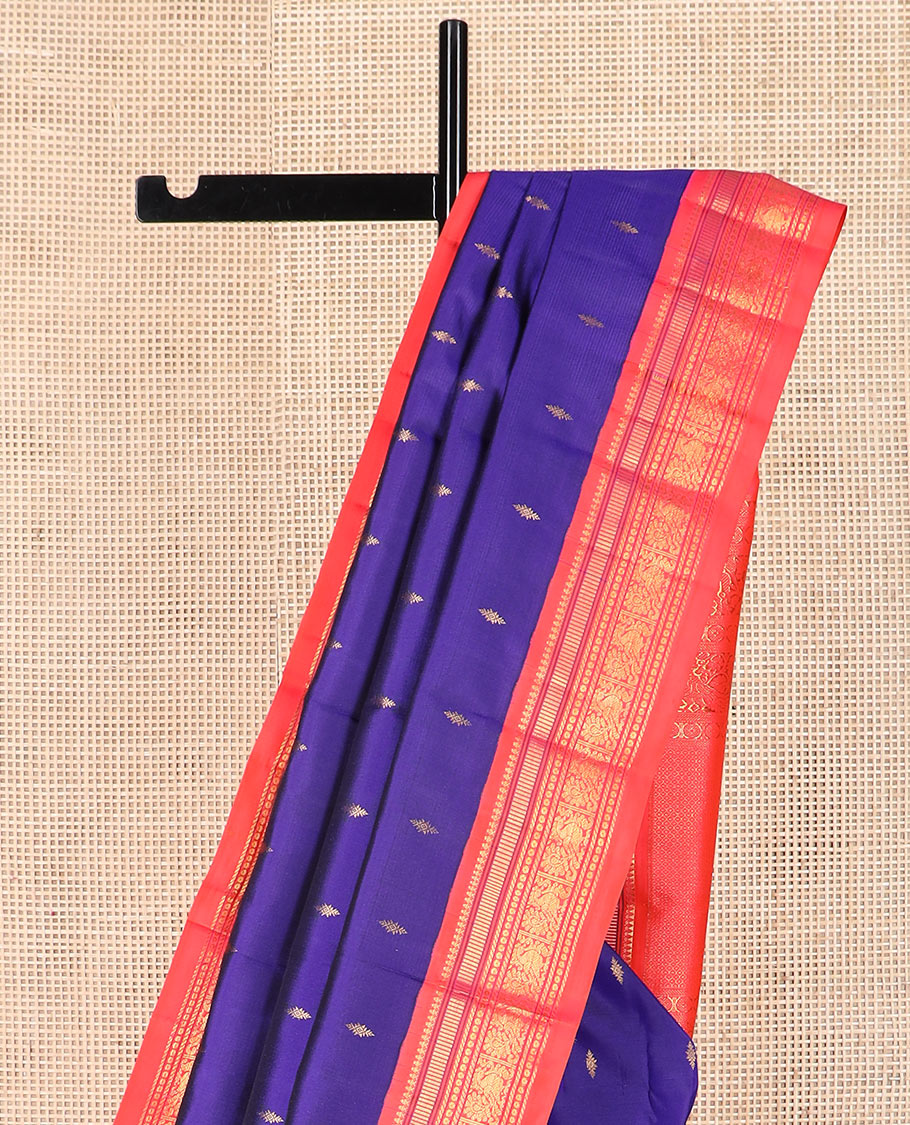 Blue zari buttas Kanchipuram silk saree, contrast border of thilakam mokku, muthu, banaras, and mayil designs, and pallu of intricate designs