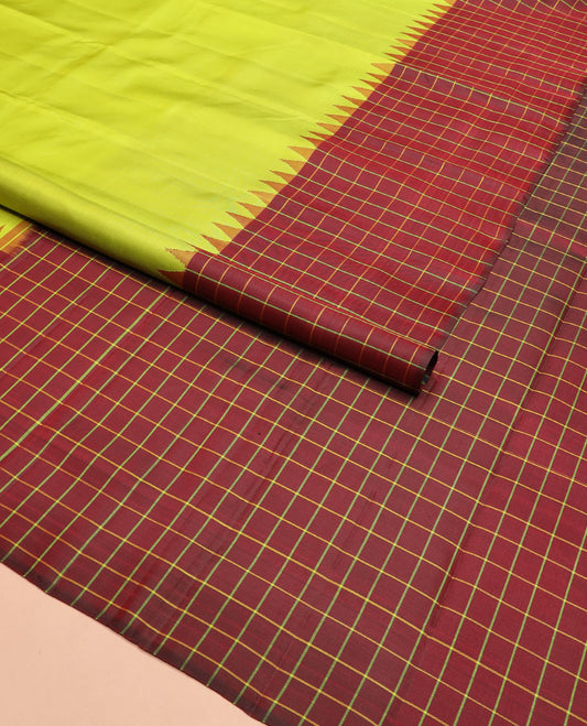 Leaf green plain Kanchipuram silk saree, contrast thazampoo rekku checked border, and checked pallu