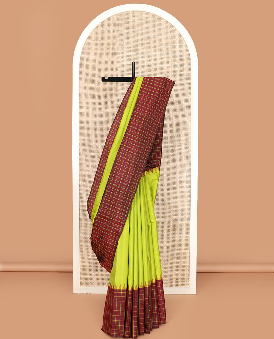 Leaf green plain Kanchipuram silk saree, contrast thazampoo rekku checked border, and checked pallu