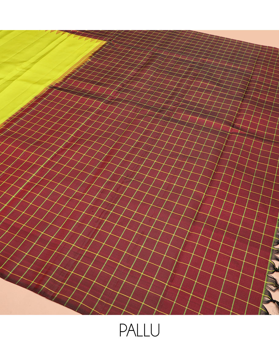Leaf green plain Kanchipuram silk saree, contrast thazampoo rekku checked border, and checked pallu