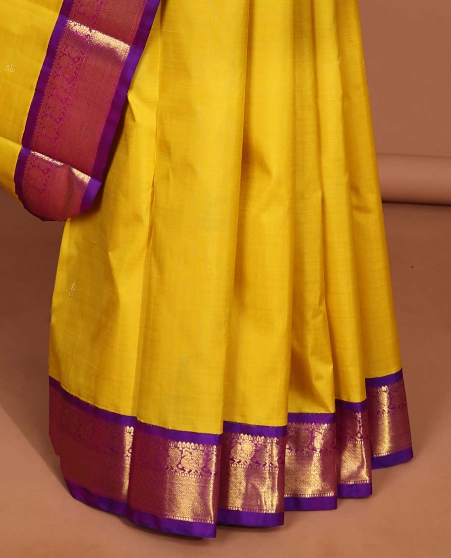 Yellow kancheepuram silk saree with intricate zari pallu & korvai border og rekku, muthu,mayil,mayil kann designs