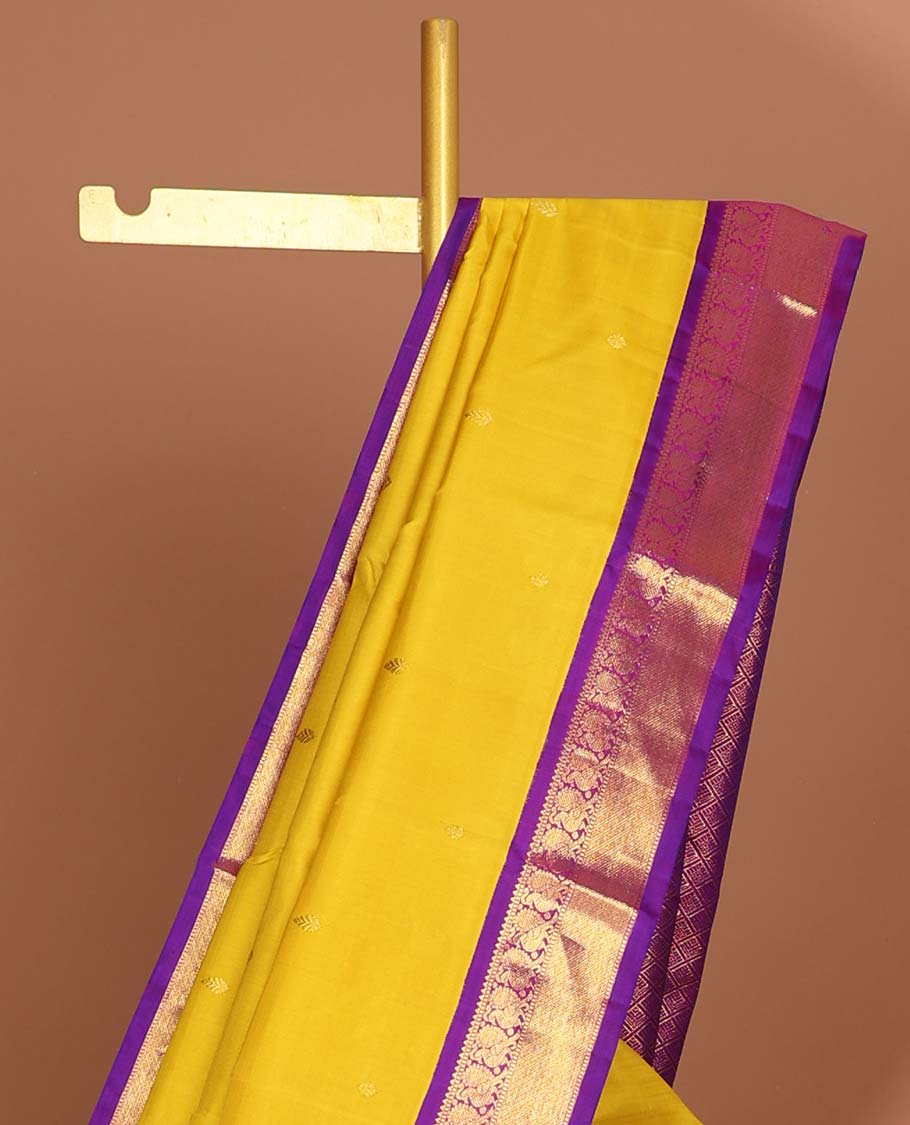 Yellow kancheepuram silk saree with intricate zari pallu & korvai border og rekku, muthu,mayil,mayil kann designs