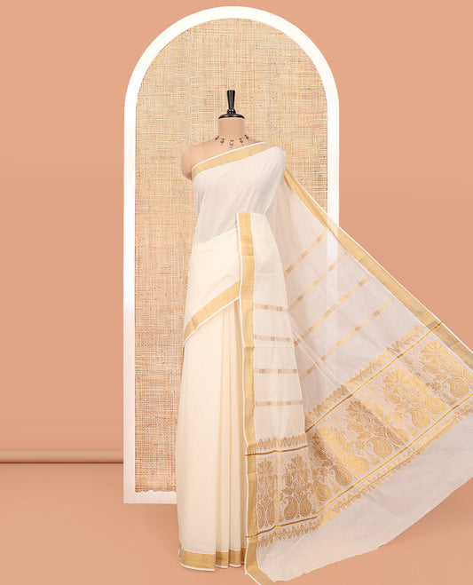 Cream Kerala Cotton Saree, Embellished with Zari Stripes All Over Its Body, a Subtle Bavanji Border, Pallu of Floral-Paisley Designs, and Paired with a Matching Blouse