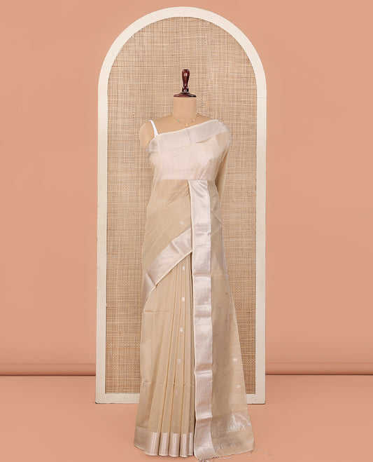 Beige Maheshwari Cotton Saree, Detailed with Flower Buttas All Over Its Body, Highlighted by Traditional Zari Design Border, Pallu Steeped with Flower Buttas, and Paired with a Matching Blouse