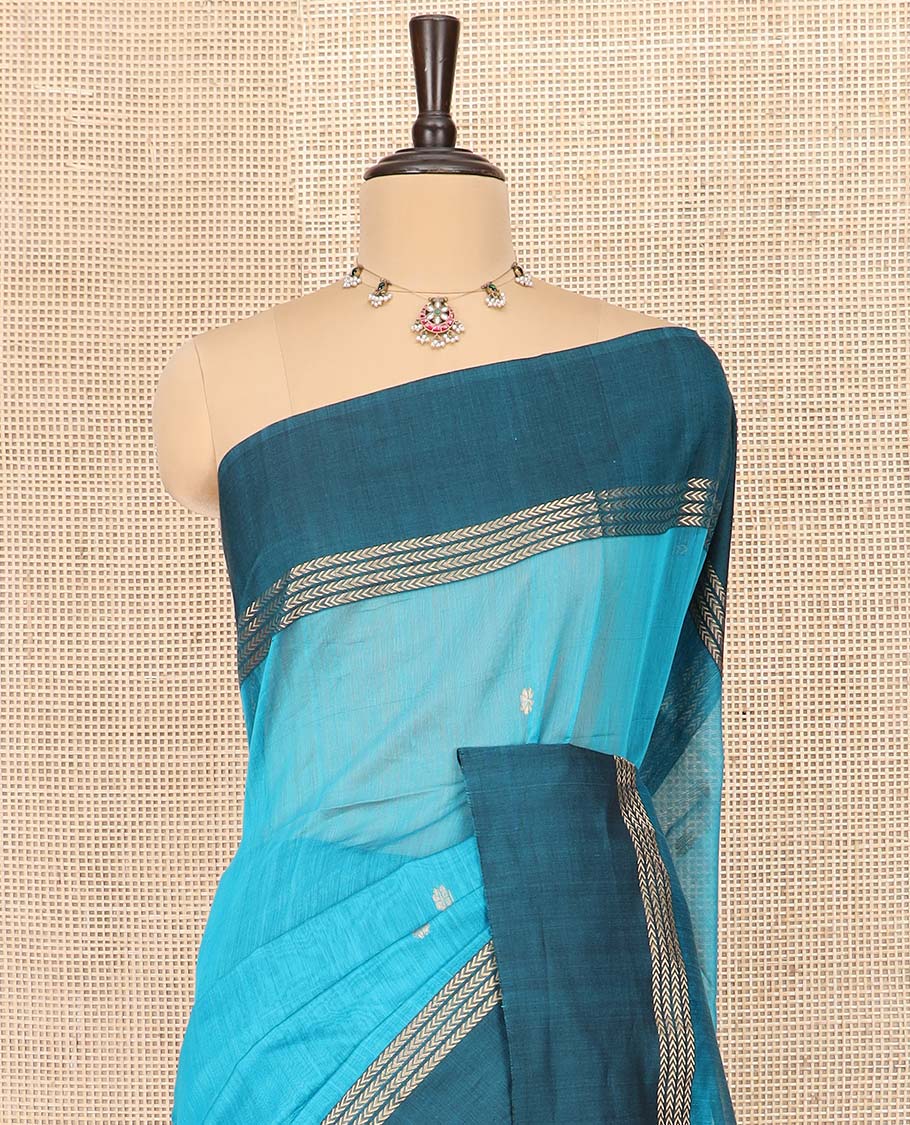 Blue Maheshwari Cotton Saree Adorned with Zari Buttas, Highlighted with Contrast Zari Leaf Striped Border, Pallu Scintillated with Jaal Designs, and Paired with a Matching Blouse
