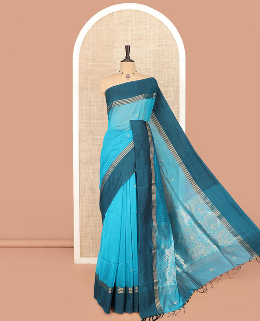 Blue Maheshwari Cotton Saree Adorned with Zari Buttas, Highlighted with Contrast Zari Leaf Striped Border, Pallu Scintillated with Jaal Designs, and Paired with a Matching Blouse