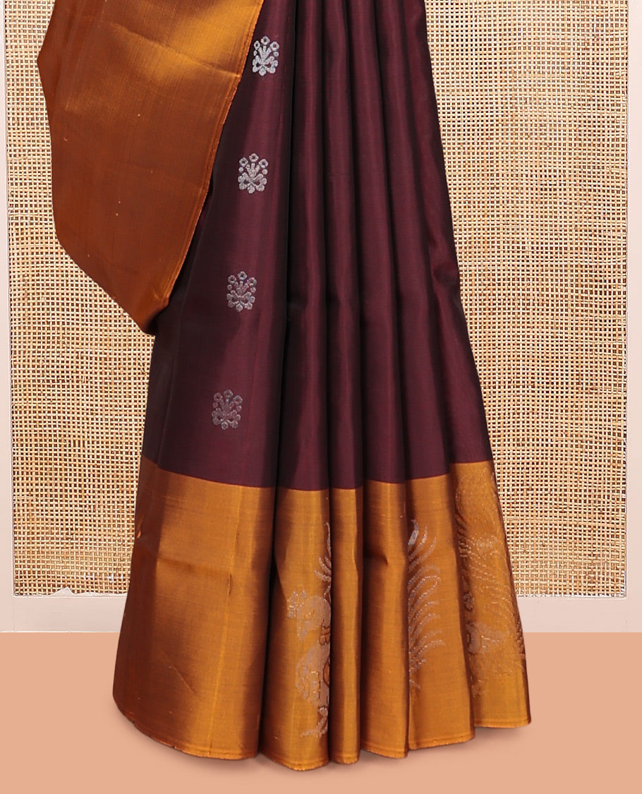 Maroon Mayuri Lite Silk Mix Saree, Bedecked with Zari Buttas, Complemented By Contrast Peacock Buttas Border, a Floral Vine Pallu, and a Contrast Blouse