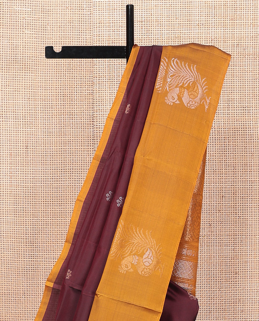Maroon Mayuri Lite Silk Mix Saree, Bedecked with Zari Buttas, Complemented By Contrast Peacock Buttas Border, a Floral Vine Pallu, and a Contrast Blouse
