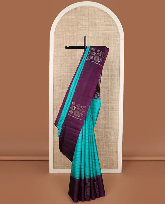 Blue checked soft silk saree, contrast unique-shaped floral & leaf motif border & pallu steeped with unique-shaped floral & leaf motifs