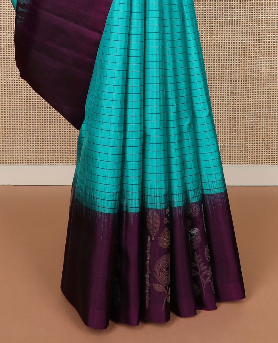 Blue checked soft silk saree, contrast unique-shaped floral & leaf motif border & pallu steeped with unique-shaped floral & leaf motifs