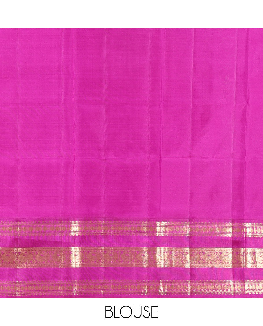 White Vasundhara Silk Saree Elegantly Embellished with Zari Buttas, Complemented by a Varisai Pettu Border Featuring Rekku, Muthu, Banaras, Rudraksham, and Mayil Designs, Majestically Woven with a Zari-Designed Pallu, and Paired with a Contrast Blouse