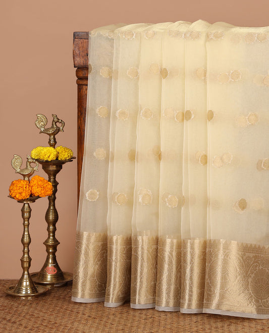 Cream semi-organza saree with zari buttas, zari border of temple & floral creeper designs, zari design pallu & running blouse