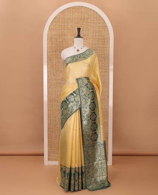 Yellow Antique buttas twill tissue saree, contrast satin thread woven border & pallu of mughal-style motifs & buttas dark green blouse