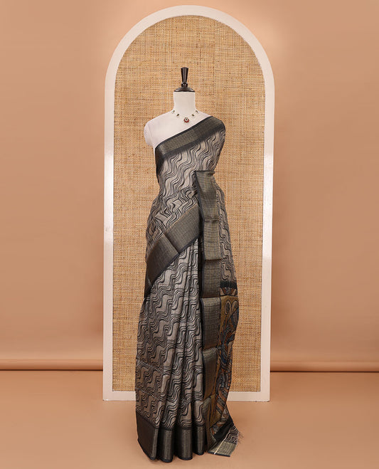 Chikku zig-zag stripes printed semi-jute saree, contrast geometric zari border, Madhubani-style printed pallu, & black blouse of print & zari work