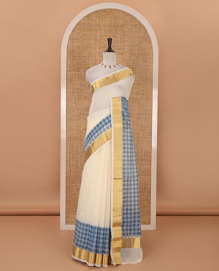 Cream with blue kerala cotton saree , diamond style printed with gold zari tissue bawanchi border & diamond pattern printed pallu with plain blouse