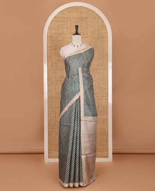 Rama green lehariya-style striped semi-tussar saree, contrast resham thread triangle motifs border, diamond printed pallu & contrast printed blouse