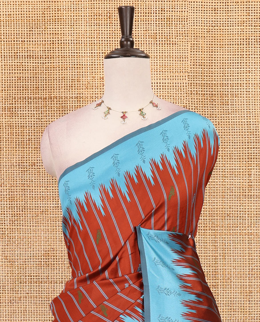 Rust vertical striped & parrot motifs kanchi silk saree, contrast satin temple border, zari-rich jaal pallu & contrast zari design blouse