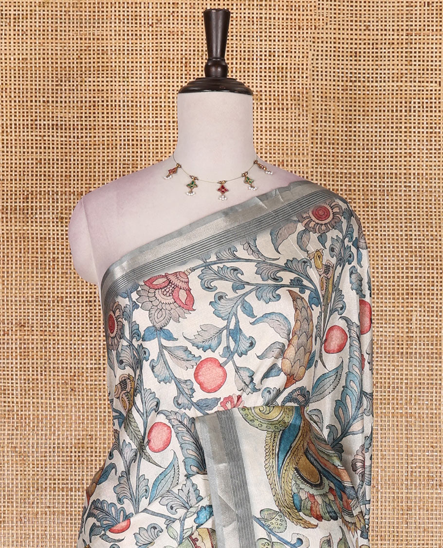 Cream-base multi-color kalamkari floral-vine and peacocks printed semi-tussar saree, gold zari piping border, kalamkari printed pallu, and contrast printed blouse