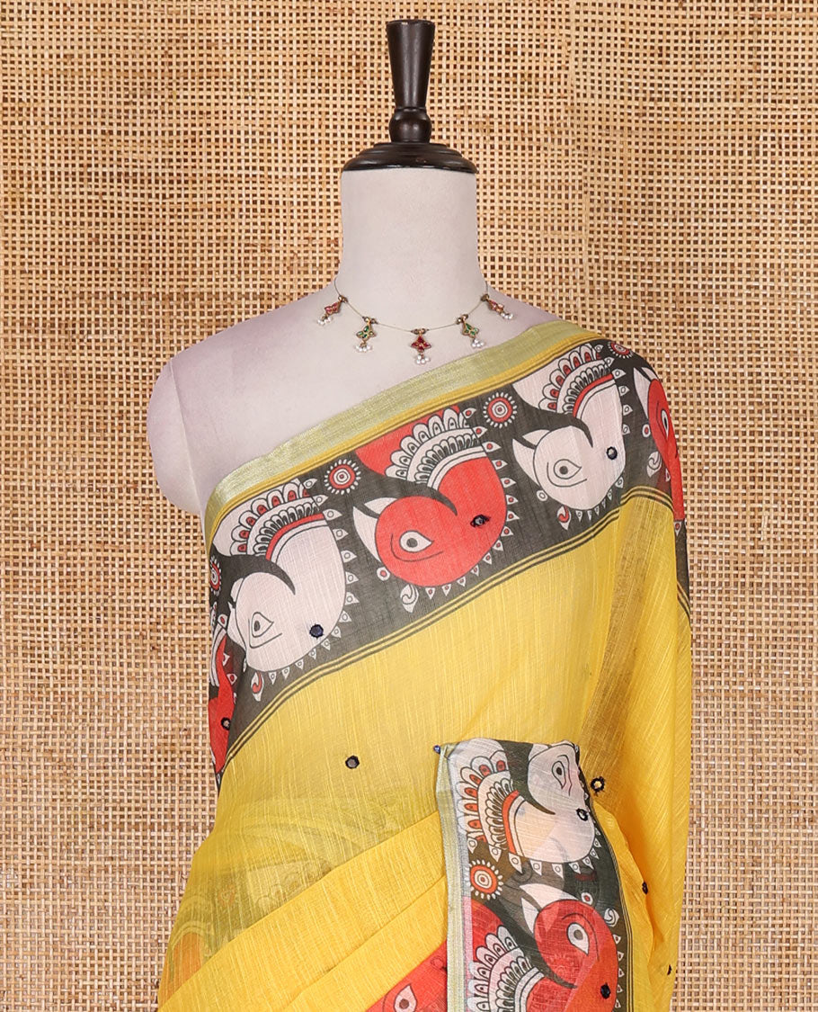 Yellow mirror thread embroidered linen saree, contrast kalamkari peacock printed border, pallu of kalamkari peacock and human figurines print, and printed blouse