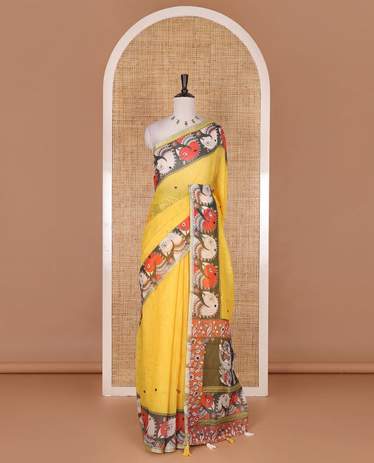 Yellow mirror thread embroidered linen saree, contrast kalamkari peacock printed border, pallu of kalamkari peacock and human figurines print, and printed blouse