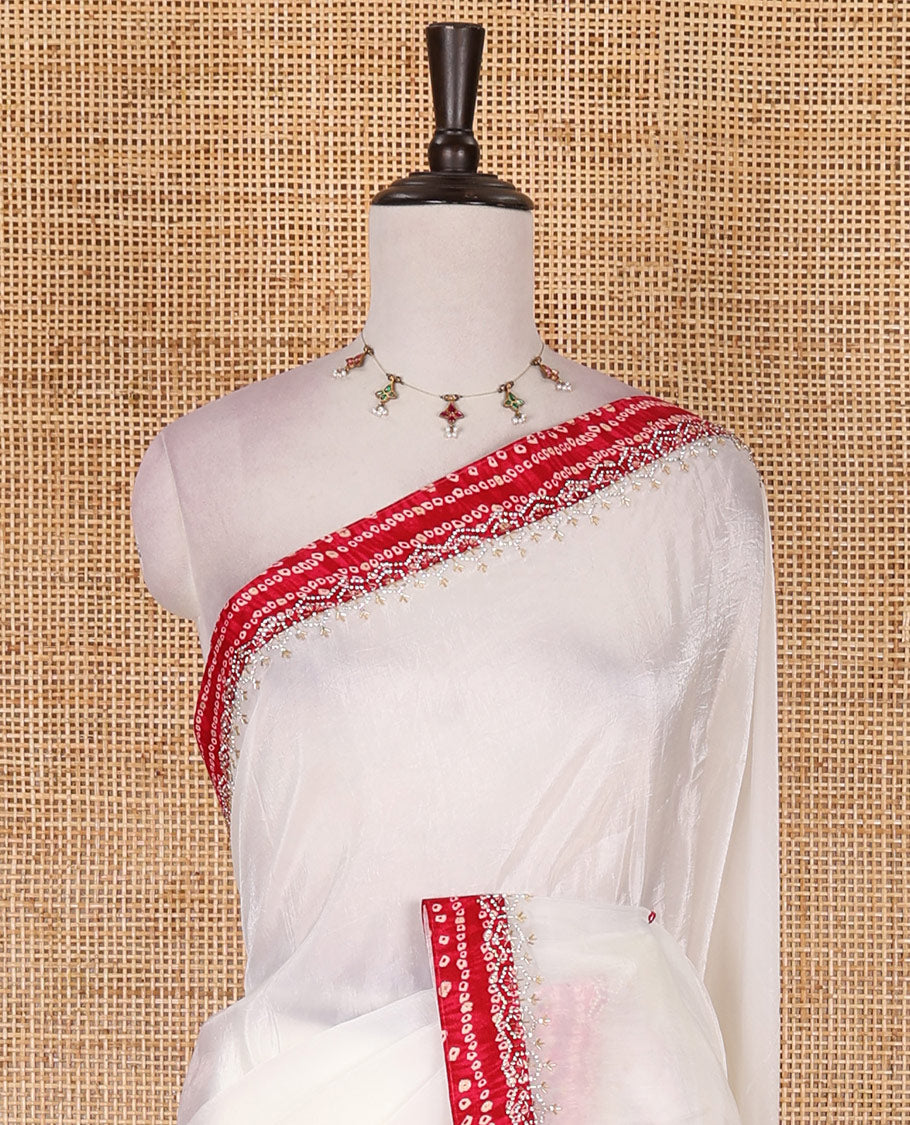 White bandhani mango jhumka patch embroidered crunchy crushed saree, contrast border, and pallu of Swarovski stonework, bandhani dots, and bandhani printed blouse