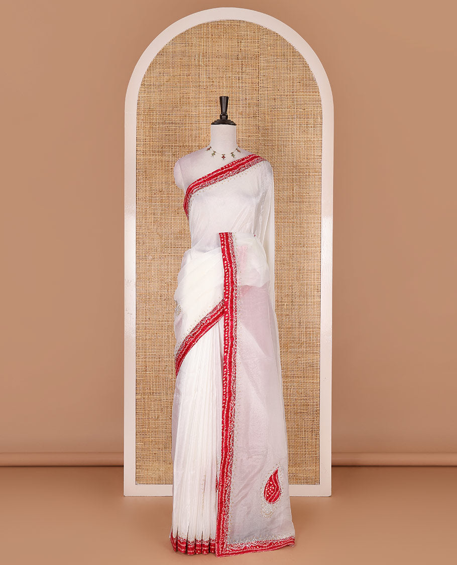 White bandhani mango jhumka patch embroidered crunchy crushed saree, contrast border, and pallu of Swarovski stonework, bandhani dots, and bandhani printed blouse