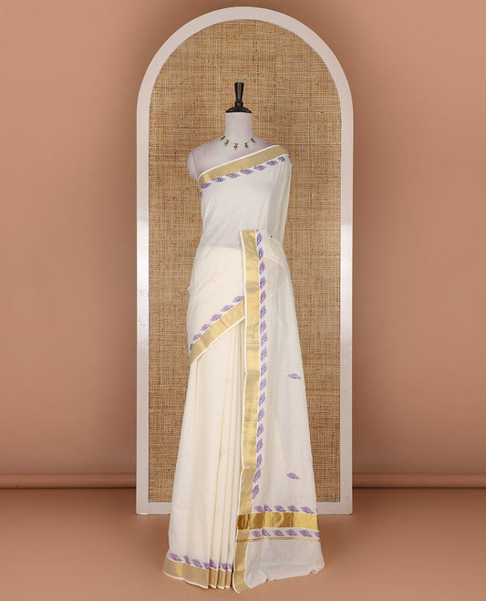 Half-white peacock feather motifs printed Kerala cotton saree, gold zari border, peacock feather printed pallu, and matching blouse
