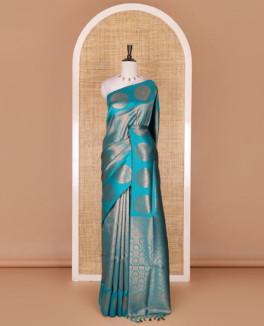 Rama green jacquard kanchi tissue saree, zari chakram motifs border, intricately zari woven pallu, and a matching zari design blouse