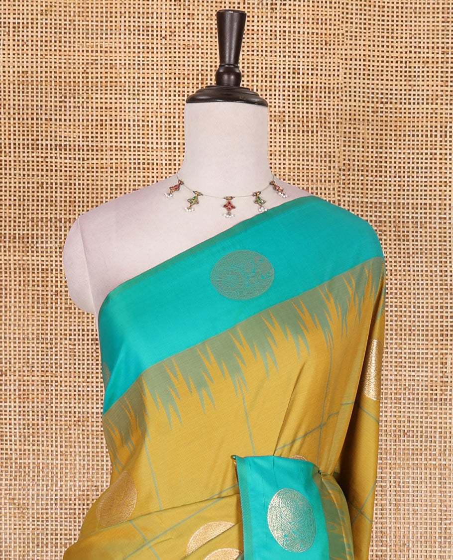 Green round peacock chakram buttas enclosed checked Mulberry silk saree, contrast round peacock chakra border, zari worven pallu, and contrast zari blouse